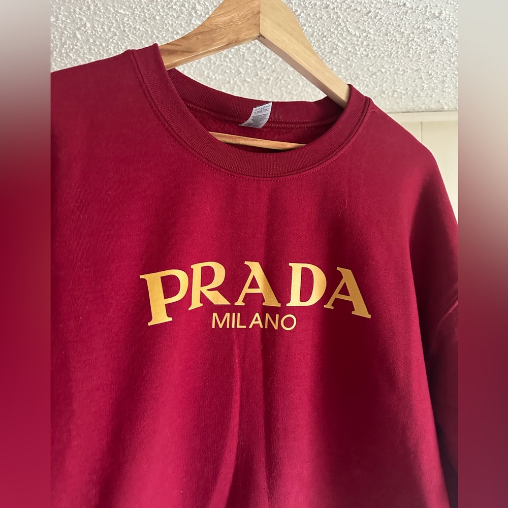 Prada sweatshirt .. unisex in great condition casual sweatshirt . Maroon color